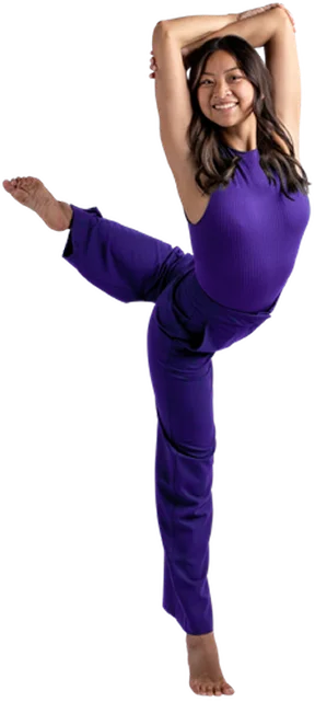 Dance Barre student in purple outfit performing a high kick